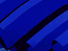 a close up of a blue skirt with a red bow on it