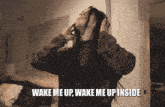 a woman wearing headphones with the words wake me up wake me up inside