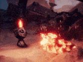 a statue of a monster is standing next to a fire .