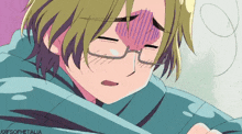 a boy with glasses is wrapped in a blanket and has a purple heart on his forehead .