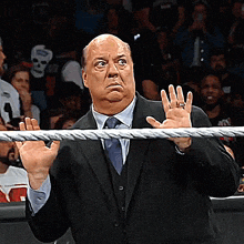 a man in a suit and tie is holding onto a rope