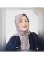 a woman wearing a hijab and a shirt that says iguana