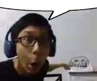a man wearing headphones and glasses is talking to a troll .