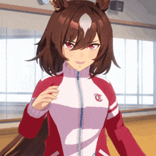 a girl with brown hair and red eyes is wearing a red jacket with the letter t on it