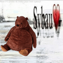 a stuffed bear is sitting in front of a snowy background with sybau written on it