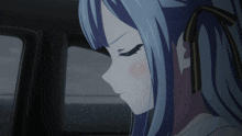 a girl with blue hair is looking out a car window