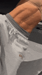 a woman 's torso is shown with a pair of sweatpants that say new york on them