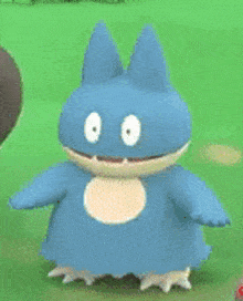 a blue cartoon character is standing on a grassy field .