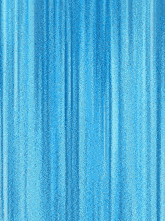 a man in a pink and black outfit is kicking in front of a blue curtain