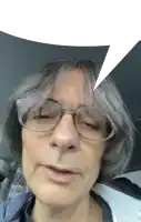a close up of a man 's face with a speech bubble above his head