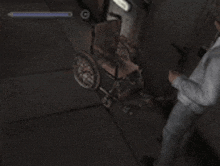a man is standing next to a wheelchair in a video game ..