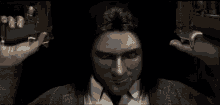 a pixelated image of a man with long hair holding a gun