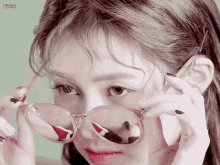 a close up of a woman wearing sunglasses with the words brilliant summer on the bottom right