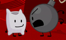 a white pillow and a gray bomb are standing next to each other