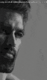 a black and white photo of a man with a beard and a caption that says jeg en del af