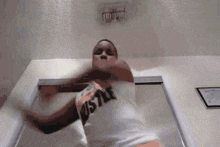 a person wearing a shirt that says hustle is dancing