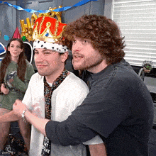 a man wearing a crown and a shirt that says it 's my bday
