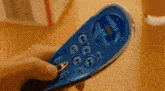 a person is holding a remote control that says video on the screen