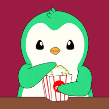 a green penguin is holding a striped container of popcorn with the letter p on it