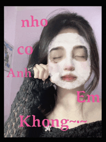 a girl with a white mask on her face with the words nho co anh em written on the bottom
