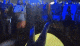 a person is blowing up a yellow balloon with the word fuse written on it
