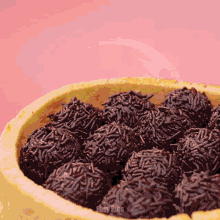 a close up of a bowl of chocolate truffles with easy pins written on the bottom