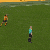a soccer player wearing a jersey with the number 4 runs towards the goal