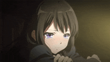 a close up of a girl with tears in her eyes