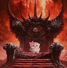a white cat with a pink bow is sitting on a demon 's throne .