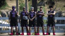 a group of men standing next to each other wearing paul 's 18 jerseys