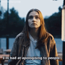 a woman in a leather jacket says i 'm bad at apologizing to people