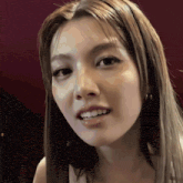 a close up of a woman 's face with long hair