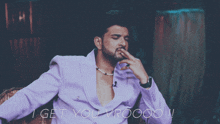 a man in a purple suit with the words i get you vroooo written below him