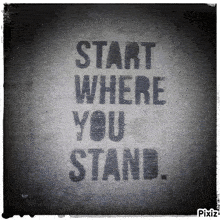a black and white poster that says start where you stand