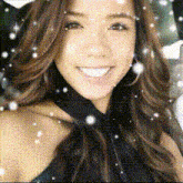 a close up of a woman 's face with snow falling on it