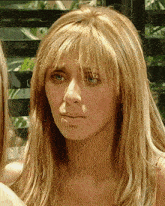 a close up of a woman 's face with the word cube on the bottom left