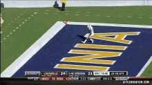 a football game is underway between louisville and virginia