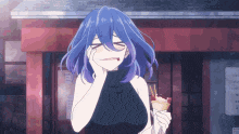 a girl with blue hair is holding an ice cream cone and making a face .