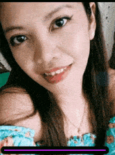 a close up of a woman 's face with a purple line in the corner