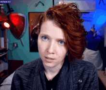 a woman with red hair looks at the camera with rexsub x41 in the upper right corner
