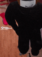 a person wearing a black shirt with the word vigge.ai on it