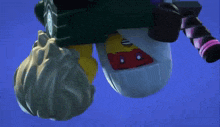 a ninjago character is flying through the air with a bag on his back .