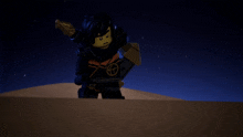 a lego figure with a sword and shield is standing in the desert