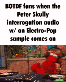 elmo from sesame street is playing a record on a turntable