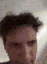a close up of a person 's face with a polka dot background