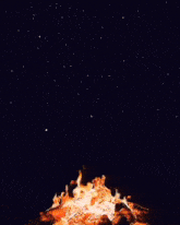 a large fire is burning in the night sky