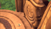 a close up of a statue with a circular design on it