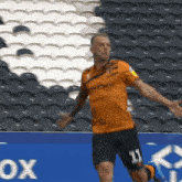 a soccer player with the number 11 on the shorts
