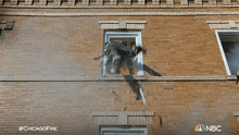 Nearly Fall Down Chicago Fire GIF - Nearly Fall Down Chicago Fire Grasping The Window Frame GIFs