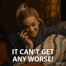 a woman laying on a bed talking on a cell phone with the words " it can 't get any worse " below her
